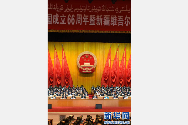 10月1日，慶祝中華人民共和國成立66周年暨新疆維吾爾自治區(qū)成立60周年大會在新疆人民會堂隆重舉行。 新華社記者 高潔 攝 