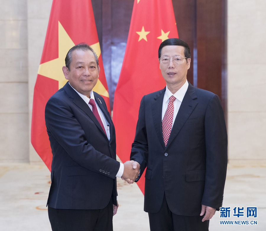  9月11日，中共中央政治局常委、國務院副總理張高麗在廣西南寧會見前來出席第十四屆中國－東盟博覽會和中國－東盟商務與投資峰會的越南常務副總理張和平。新華社記者王曄攝