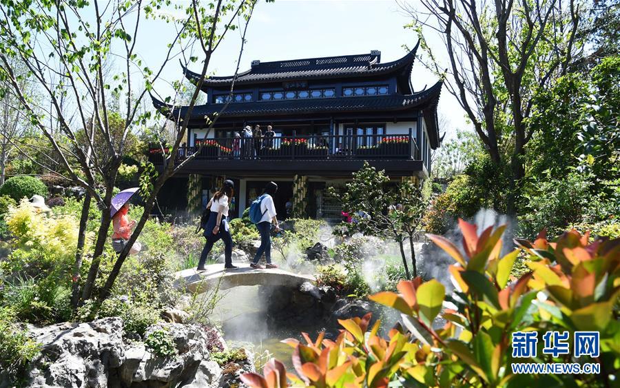 (在習(xí)近平新時代中國特色社會主義思想指引下——新時代新作為新篇章·圖文互動)(5)從世園會“看”中國綠色發(fā)展之路——寫在北京世園會“中國國家館日”到來之際